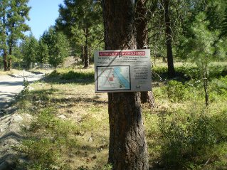 On gravel section of Garnet Valley Road, sign about Motor Vehicle restrictions, Mount Eneas 2011-08.